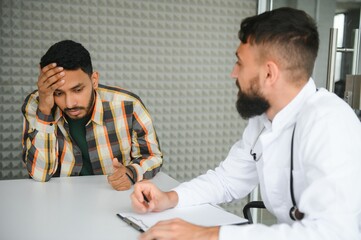 An Indian man is being examined by a doctor. Arab doctor. Health concept