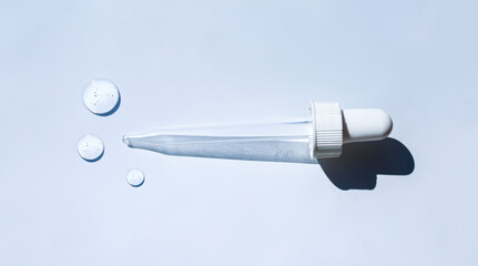 pipette drop of serum test on gray background