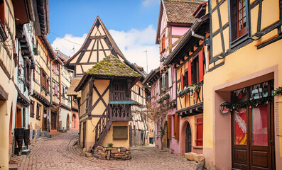 Fototapeta na wymiar Colorful half-timbered houses in Eguisheim, Alsace, France 