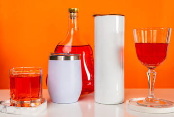 Embrace the timeless allure of a white blank tumbler in this captivating mockup image, perfectly arranged with a wine-themed twist
