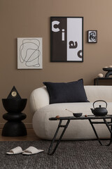 Living room interior with mock up poster frame, white sofa, stylish coffee table, brown wall, modern pouf, plaid, black pillow, vase with branch and personal black accessories. Home decor. Template.
