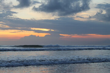 sunset wave on the Bali beach