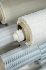 Rolls of fabric for roller blinds are in production