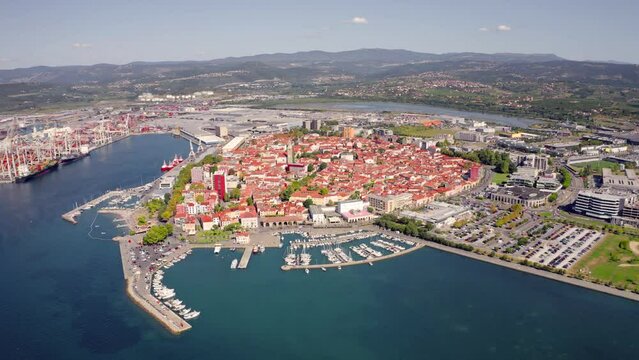 4k drone forward video (Ultra High Definition) of Koper port. Aerial outdoor scene of Adriatic coastline, Slovenia, Europe. Stunning Mediterranean seascape. Traveling concept background..