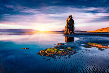 Dramatic summer view of huge basalt stack Hvtserkur on the eastern shore of the Vatnsnes peninsula. Picturesque sunrise in Iceland, Europe. Beauty of nature concept background.. - obrazy, fototapety, plakaty