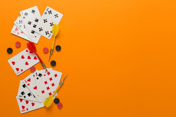 Different board games on color background, top view