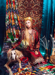 girl in national costume with a dog in oriental style