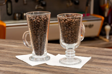 Two glasses with coffee beans 