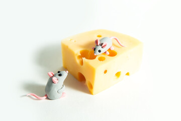 Little plasticine mice and a piece of cheese with holes.