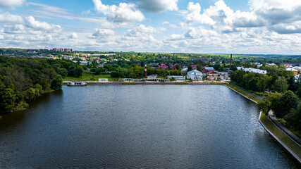 Obraz premium panoramic view of the white old stone manor on the shore of the lake and with the park in the city of Bogoroditsk