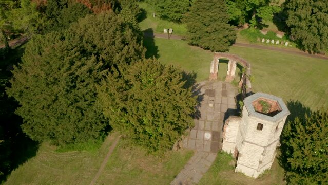 Descending aerial shot over crumbling old church holy ghost cemetery Basingstoke