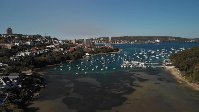 Aerial views of Sail boats, ships, yachts over Balgowlah, Fairlight and Manly. Perfect for travel and tourism. Experience the charm of this coastal city in 4k Sydney Australia