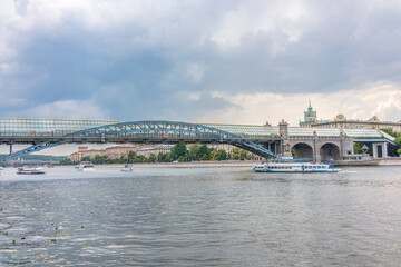 View of the Moscow river embakment, Pushkinsky bridge and cruise ships at sunset.