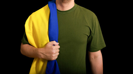 The military man holds the national flag of the Country on a black background. - 626836700