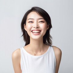 A young and beautiful Asian girl lights up the frame with her enchanting smile, dressed in a crisp white vest, set against a clean and immaculate white background. generative AI.