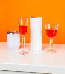 A captivating mockup image beautifully presents a white blank tumbler, artfully arranged with a touch of wine-themed allure