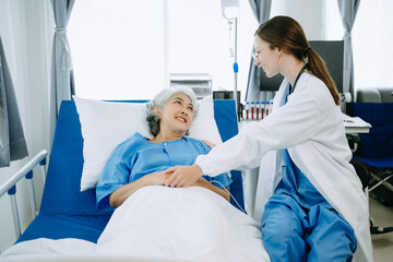 Woman Doctor and patient discussing something while sitting on examination bed in modern clinic or hospital . Medicine and health care concept.