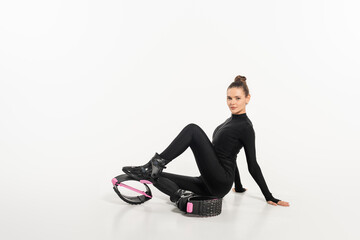 Fototapeta na wymiar sportswoman in boots for jumping and active wear, kangoo jumping, active lifestyle, cardio