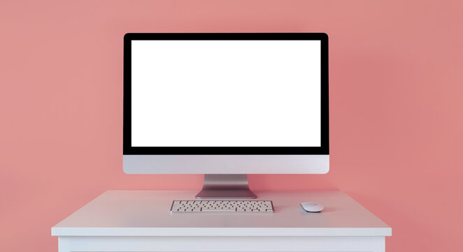 Mockup of a monitor with a white screen, with a keyboard on a table on a pink background.  Computer freelancer designer and marketer, template for online courses.