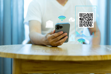 QR code on mobile phone screen, closeup. Unrecognizable businessman  holding modern smartphone with bar code, paying for goods and services with payment system,. digital money concept...