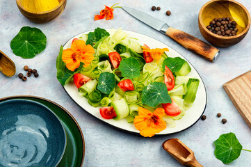 Tasty veggie salad with nasturtium