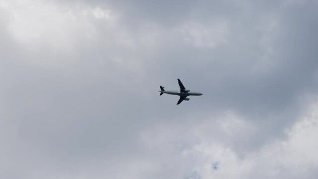 Passenger plane fly during landing on the airport