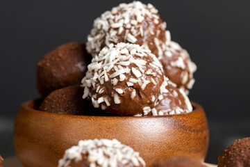 Chocolate candies with coconut flavor and filling