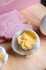 Obraz na płótnie Canvas Boiled chicken egg with sliced pieces of meat
