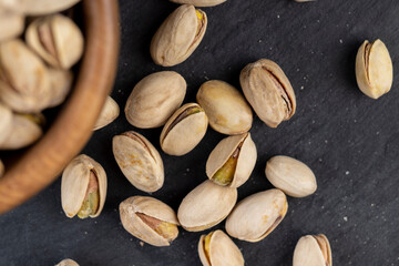 a large number of salty and crispy pistachios close-up
