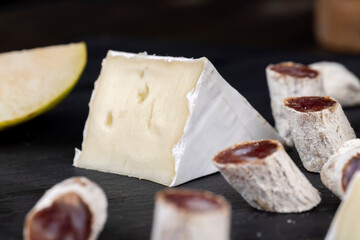 delicious sliced cheese with edible white mold