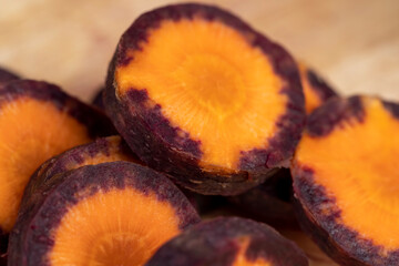 Sliced purple-orange carrots on the table