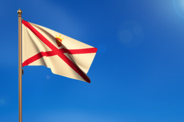 Jersey. Flag blown by the wind with blue sky in the background.