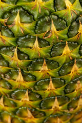 Ripe whole pineapple with green-yellow peel