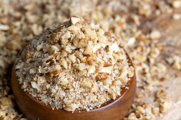 Crushed dried walnuts on the table