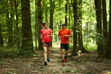 Running couple in the forest