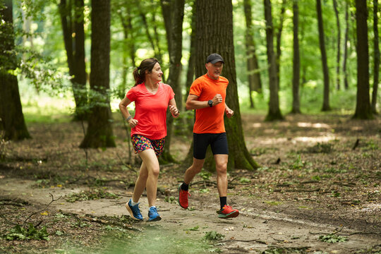 Running couple in the forest