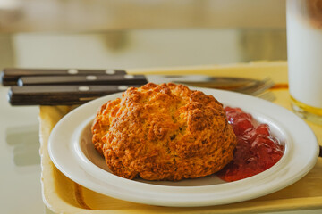 At a cafe, delicious scones and strawberry jam