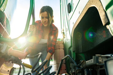 female junior driver checks the truck's equipment, practices safe driving and follows safety...