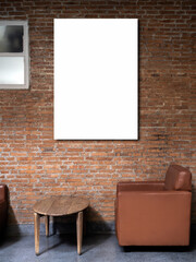 Mockup artist frame or white blank vertical poster on red brick wall background over the empty...