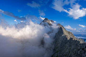 Monte Viso or Monviso, the highest mountain in the Cottian Alps (3841 m). surrounded by clouds...