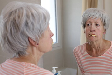 Obraz na płótnie Canvas Senior woman with dental problems 