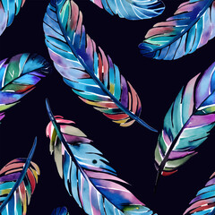 Ethnic vector seamless pattern in native style. Bright watercolor colored feathers isolated on black background