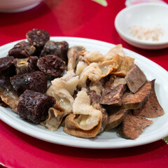 Delicious Korean cuisine Sundae and other pork edible viscera in market, street food.