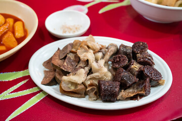 Delicious Korean cuisine Sundae and other pork edible viscera in market, street food.