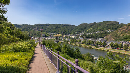 View on the German city of Cochem with the colored houses and the Reichsburg Cochem castle along the river Moselle in the state of Rheinland-Pfalz
