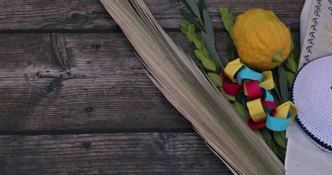 Sukkot, Jewish Orthodox festival, features use of traditional Holiday symbols such as four species Etrog, lulav, hadas, arava.