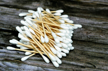 Pile of ear cotton swab buds sticks, for health care, ideal for gently cleaning around the outer surface of the ear, and a variety of beauty and personal care uses, cotton swabs, selective focus - obrazy, fototapety, plakaty