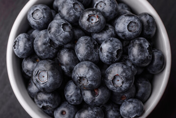 Delicious fresh sweet blueberries in a ceramic bowl. Vegan food