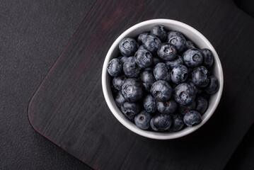 Delicious fresh sweet blueberries in a ceramic bowl. Vegan food