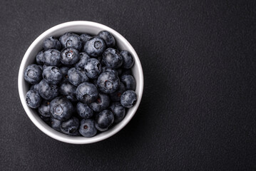 Delicious fresh sweet blueberries in a ceramic bowl. Vegan food